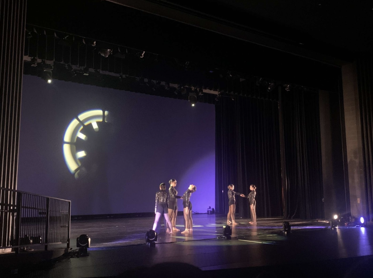 DTNT dancers perform sophomore Margy Burgoon’s dance, which features a projection of a clock to portray time passing